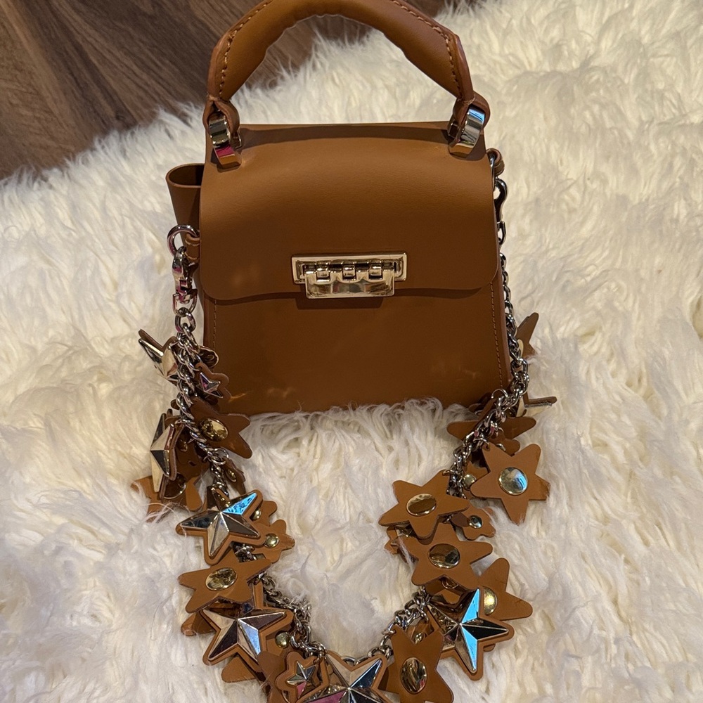 Brown Designer Handbag with Star Accents
